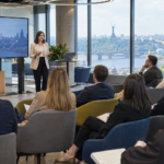 Seminar in a modern banking hub with a presenter and an engaged audience