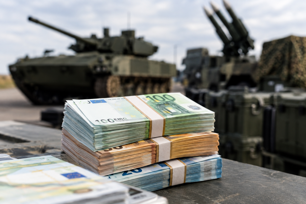 Євро банкноти на тлі військової техніки, символічна композиція
