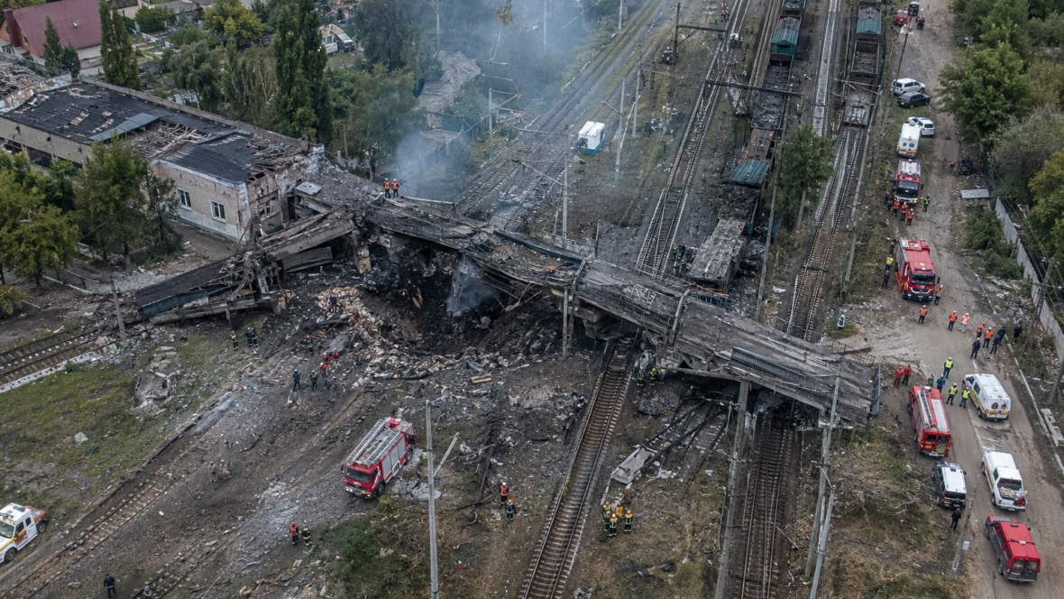 aerial view of damaged railway junction and emergency response