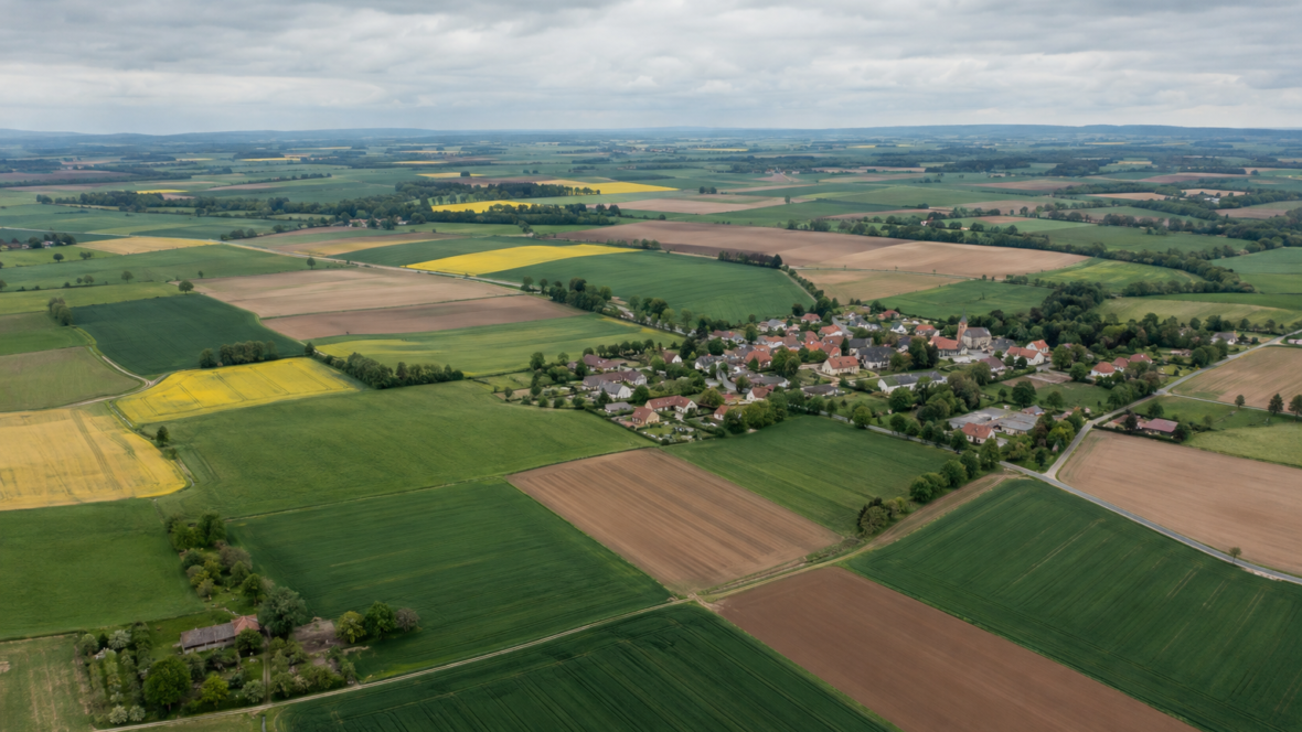 aerial view of farmland and village