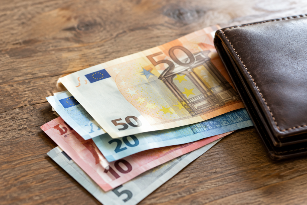Euros in a wallet on a table